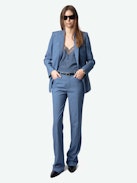 Pistol Pants - Flared tailored pants with pockets and pleats in a mottled fabric.