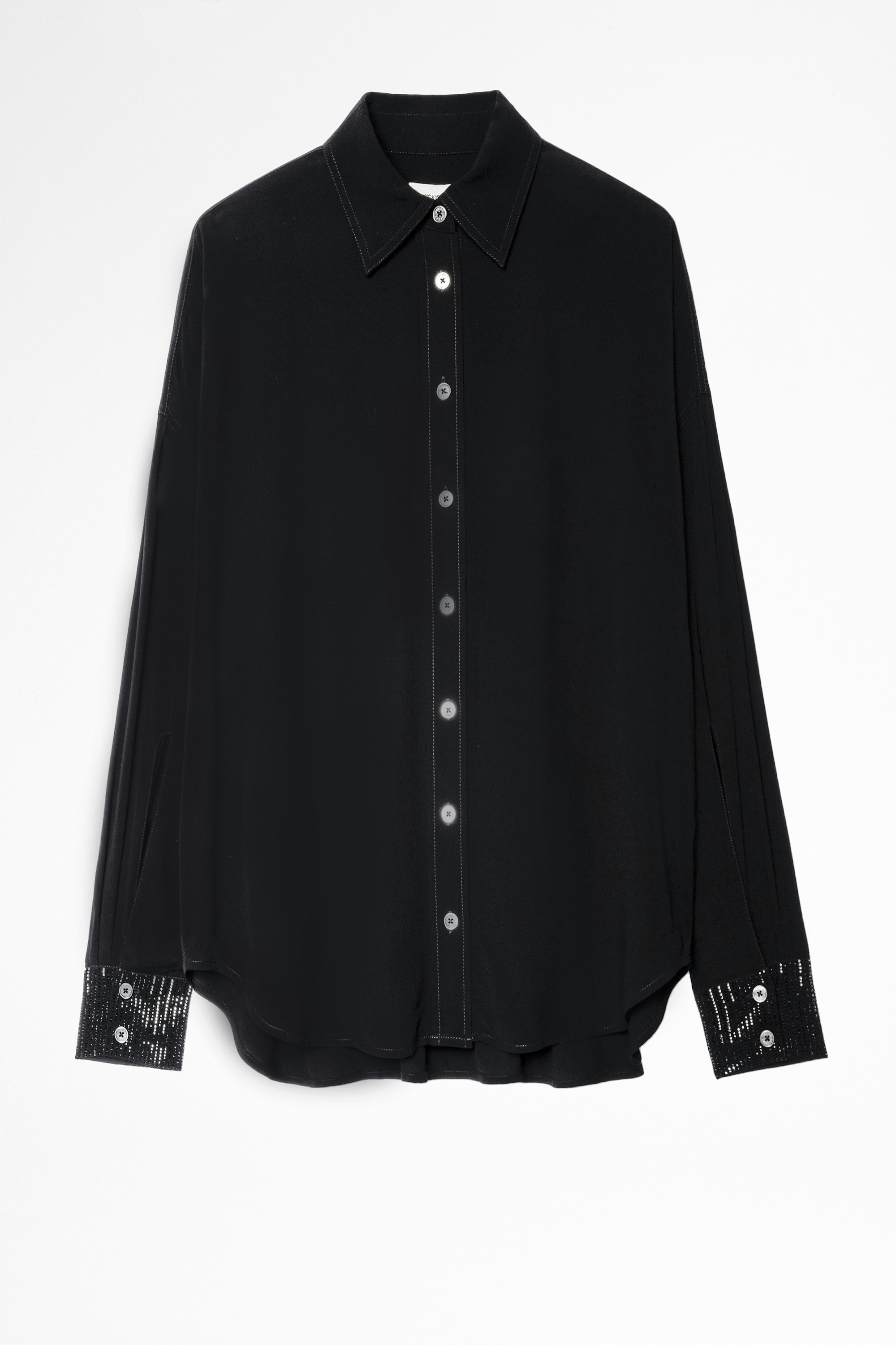 Camisa Tamara Strass Camisa negra de mujer con detalle de strass en los puños. Confeccionado con fibras procedentes de bosques de gestión sostenible.