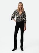 Twina Soft Crinkle Roses Shirt - Embrace timeless elegance with this women’s black roses blouse, adorned with a delicate floral print. Featuring a round, buttoned neckline and half-button closure, this blouse offers a sophisticated yet romantic look. The long sleeves with tailored cuffs provide a polished finish, making it perfect for both casual outings and formal occasions.