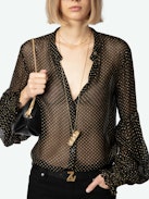 Tandy Blouse - Sheer black shirt with round neckline, button fastening, long ruffled sleeves and sequin embellishment.