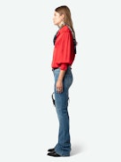 Trenta Satin Blouse - Long-sleeved satin blouse with buttoned V-neck and gathered shoulders.