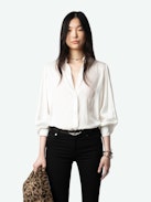 Trenta Satin Blouse - Long-sleeved white satin blouse with buttoned V-neck and gathered shoulders.