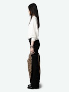 Trenta Satin Blouse - Long-sleeved white satin blouse with buttoned V-neck and gathered shoulders.