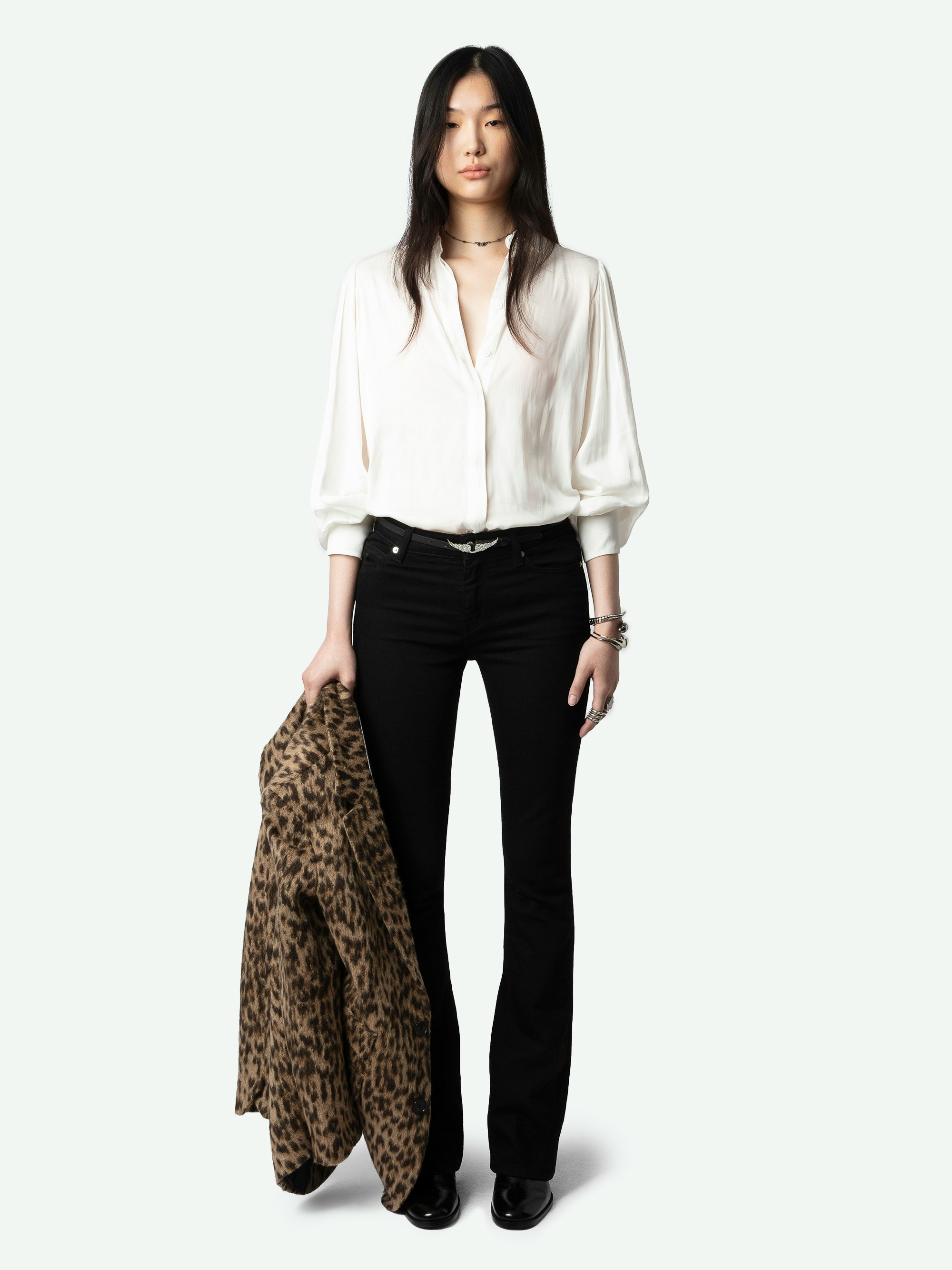 Trenta Satin Blouse - Long-sleeved white satin blouse with buttoned V-neck and gathered shoulders.