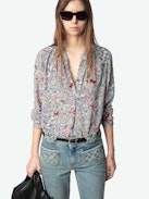 Tink Blouse - Effortless, airy, and endlessly versatile. The Tink blouse flows with a laid-back silhouette, delicate fabric, and just the right amount of undone attitude. Wear it loose, tuck it in—make it yours.