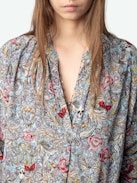Tink Blouse - Effortless, airy, and endlessly versatile. The Tink blouse flows with a laid-back silhouette, delicate fabric, and just the right amount of undone attitude. Wear it loose, tuck it in—make it yours.