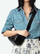 Thelma Denim Shirt - A masterful fusion of Western-inspired design and contemporary sophistication. This long-sleeved denim shirt features a button fastening adorned with jewel buttons, adding a touch of elegance to its classic silhouette.