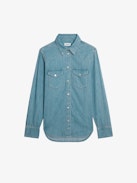 Thelma Denim Shirt - A masterful fusion of Western-inspired design and contemporary sophistication. This long-sleeved denim shirt features a button fastening adorned with jewel buttons, adding a touch of elegance to its classic silhouette.