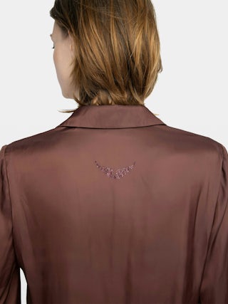 Thely Satin Shirt - Satin shirt, long sleeves, button fastening and rhinestone wing on the back.
