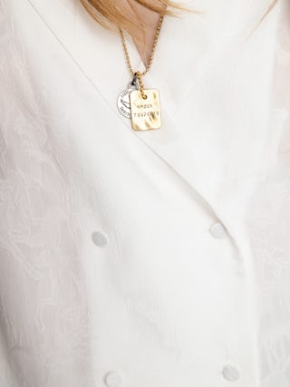 Tussi Jacquard Silk Shirt​ - Blouse in jacquard silk with horse print, long sleeves and crossed button closure.