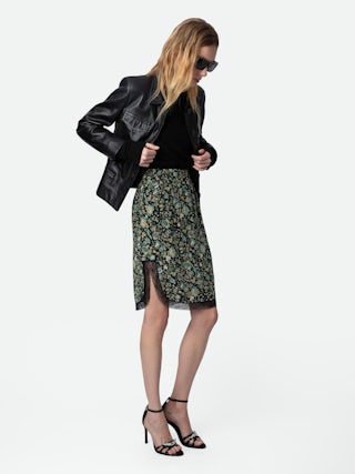 Jupe Jozy 100% Soie - Jupe mi-longue esprit lingerie en soie noire à fente, imprimé fleuri et bords en dentelle.