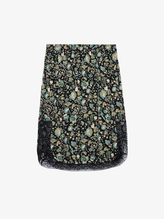 Jupe Jozy 100% Soie - Jupe mi-longue esprit lingerie en soie noire à fente, imprimé fleuri et bords en dentelle.