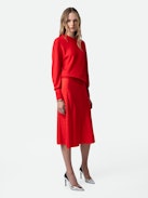 Jayla Skirt - Women’s red silk midi skirt with zip fastening, all over wing pattern, and side slit with lace detail.