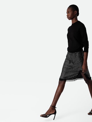 Jupe Jozy 100% Soie - Jupe mi-longue esprit lingerie en soie noire à fente, strass et bords en dentelle.