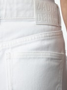Jupe Joa Denim - Jupe courte en denim blanc à poches, bords francs et boutons.