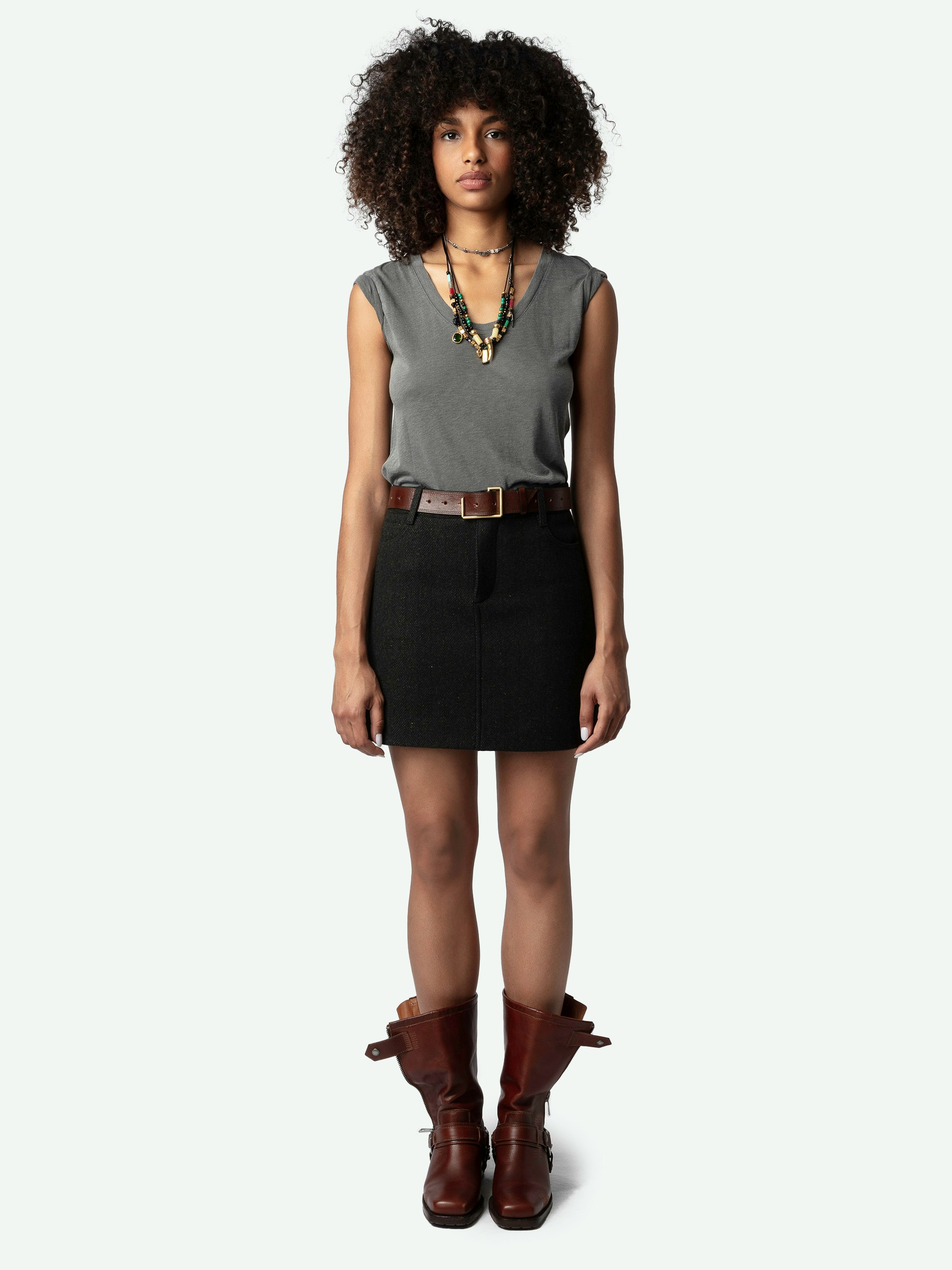 Joany Skirt - Straight mini skirt in a black wool blend with herringbone pattern and pockets.