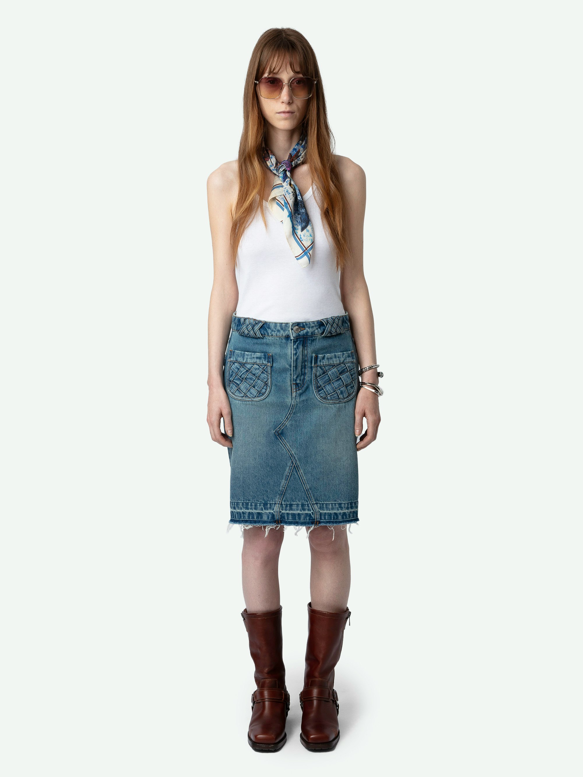 Jingle Denim Skirt - Faded blue denim mini skirt with pockets, braided details and raw edges.