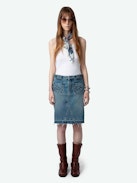 Jupe Jingle Denim - Jupe courte en denim délavé bleu à poches, détails tressés et bords bruts.