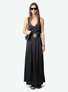 Jady Satin Skirt - Long black satin pleated skirt with slit, zip closure, and jewel button.