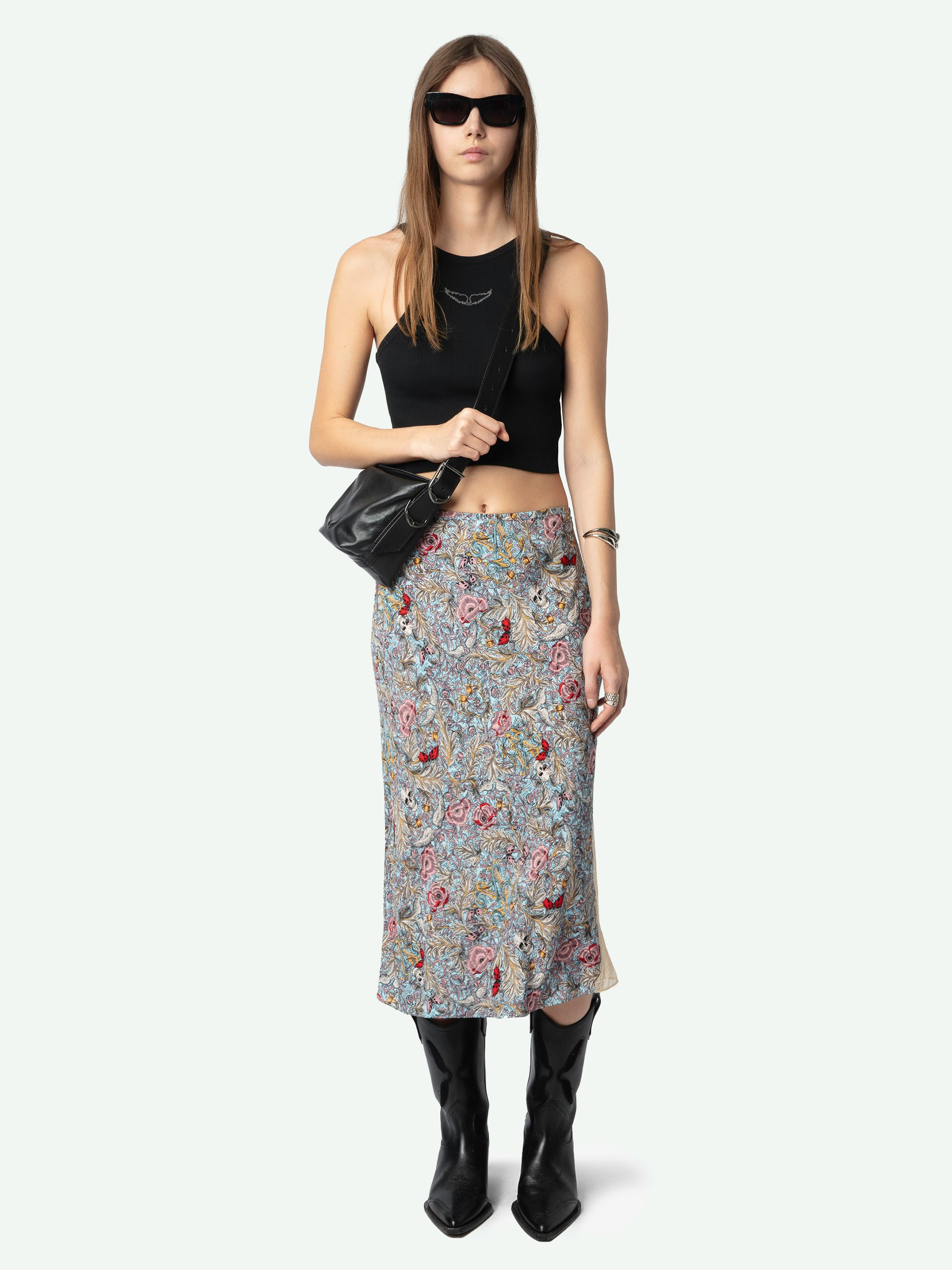 Jayla Skirt - A mid-length, lingerie-inspired piece that seamlessly blends elegance with contemporary flair. Crafted from printed viscose, this skirt features delicate lace detailing, adding a touch of sophistication to its design. Its versatile style makes it a perfect addition to any wardrobe, suitable for both casual and formal occasions.