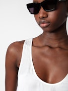 Carys Satin Top - White satin round-neck top with cutaway shoulders.