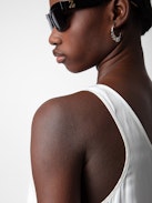 Carys Satin Top - White satin round-neck top with cutaway shoulders.