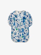 Top Tiffiny - Top de crepé en tono crudo con estampado floral Garden Flowers, cuello y bajo decorados con encaje y botones joya con strass en el lado izquierdo.