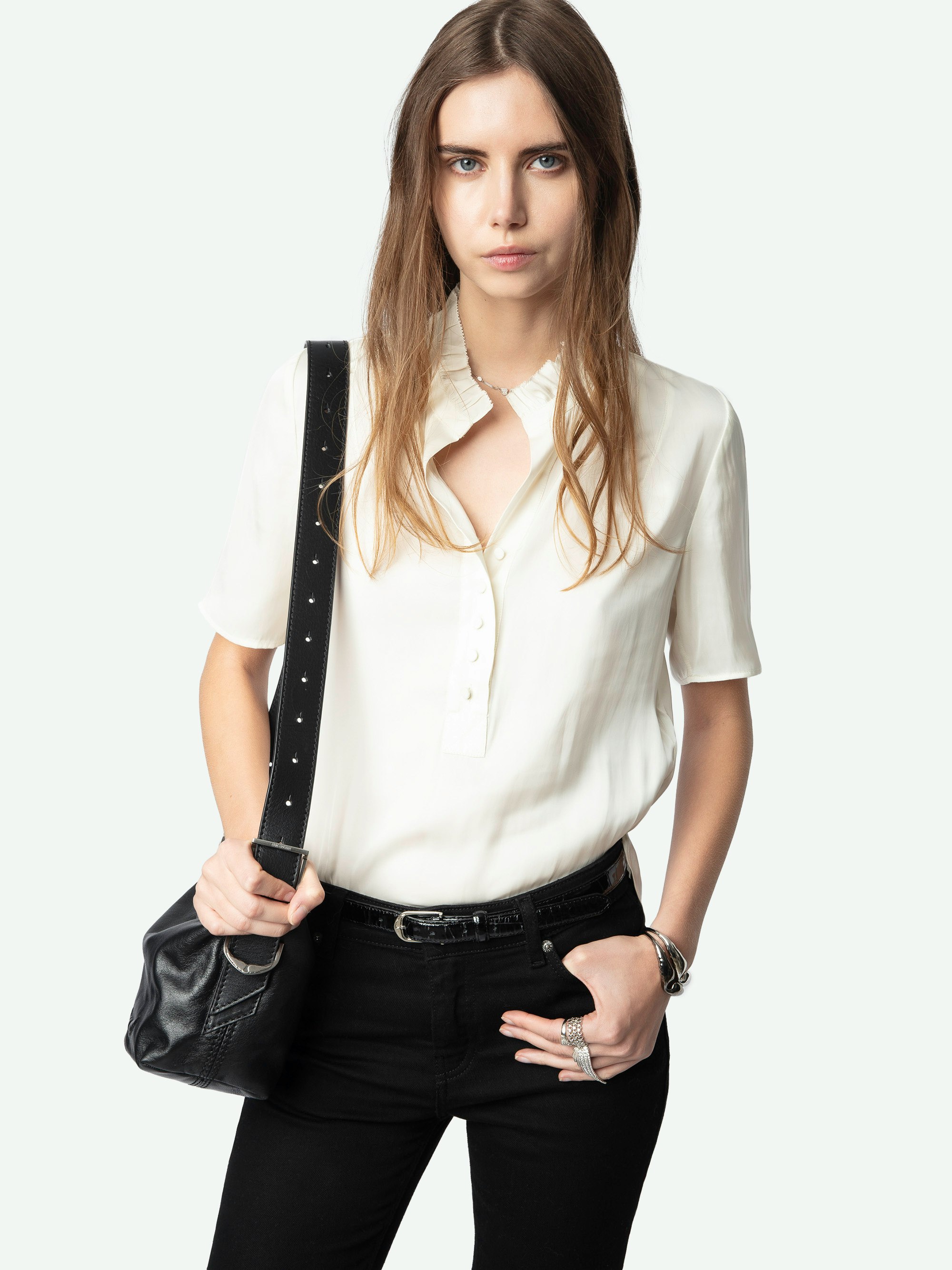 Topher Satin Top - Effortlessly polished and endlessly versatile, this ruched satin top adds a refined edge to your wardrobe. Crafted from luxurious Japanese recycled satin, it features delicate ruching along the neckline for a flattering, feminine touch. A subtle button closure and short sleeves complete the look. This ruched satin top transitions seamlessly from desk to dinner.