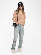 Terzo Top - Printed viscose top with laced neckline, metal wings and short sleeves.