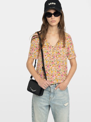 Terzo Top - Printed viscose top with laced neckline, metal wings and short sleeves.