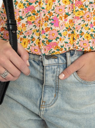 Terzo Top - Printed viscose top with laced neckline, metal wings and short sleeves.