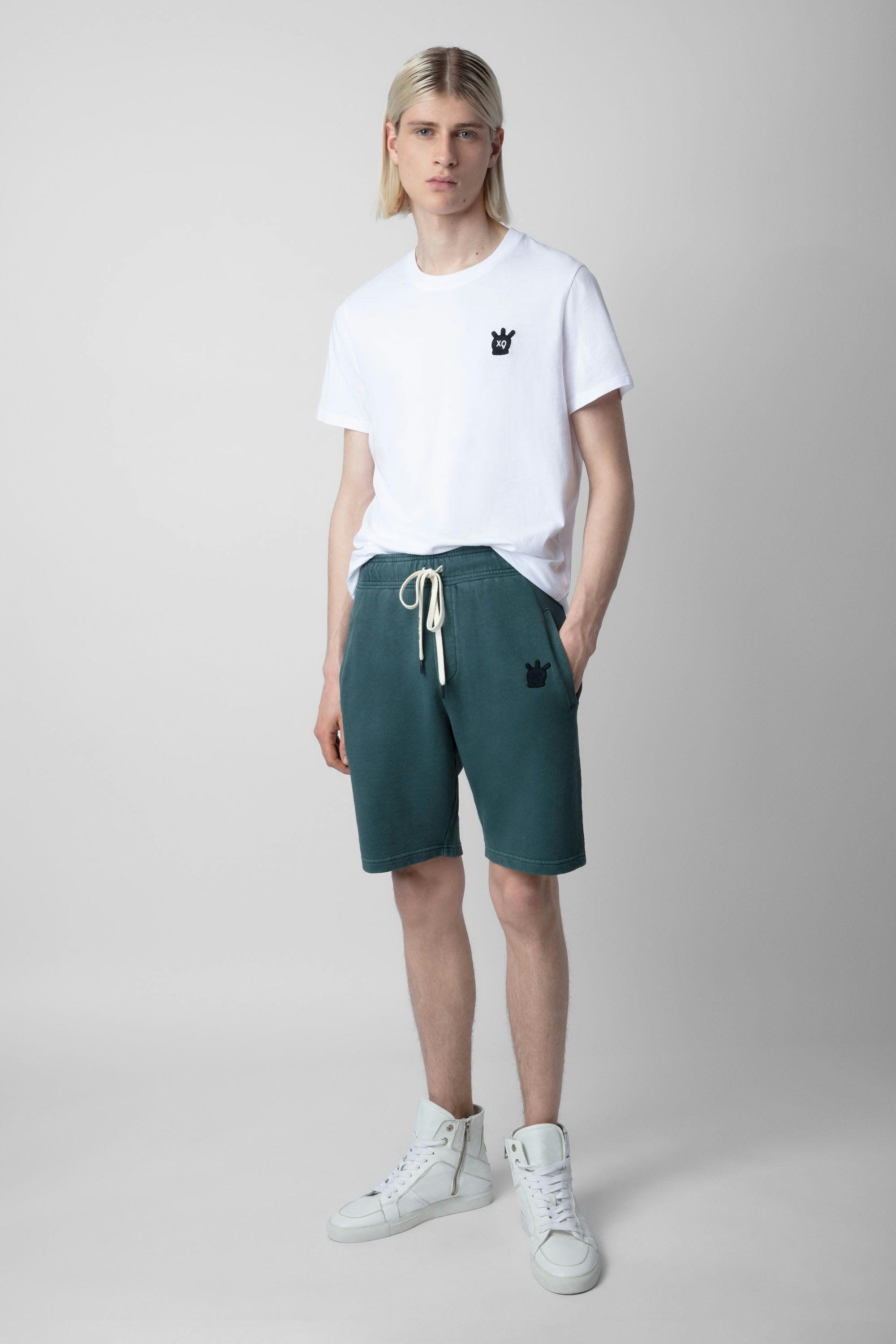 Party Skull Shorts - Men’s dark green cotton fleece shorts featuring a Skull XO patch.
