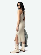 Astra Dress - A sleek tank dress that embodies the brand's signature edgy elegance. This white dress features distinctive wing-shaped embellishments on the front, adding a unique flair to its minimalist design. The Astra Dress is a versatile addition to any wardrobe, seamlessly transitioning from day to night with effortless style.
