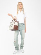 Mirta Polo - Short-sleeved cropped polo with embroidered wings on the front.