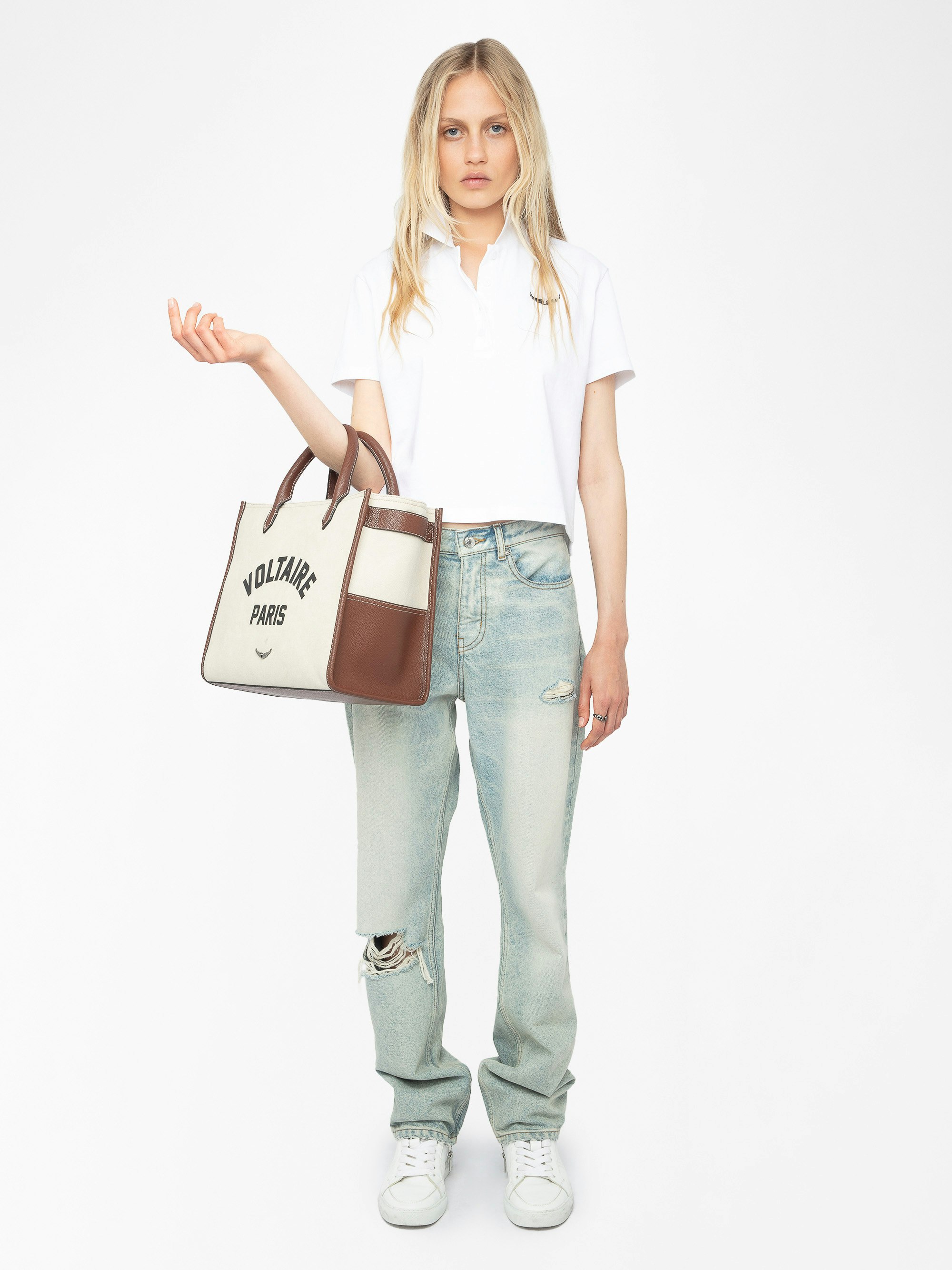 Mirta Polo - Short-sleeved cropped polo with embroidered wings on the front.