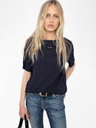 Ella T-shirt - Short-sleeved t-shirt with open back and drawstring with wing charms.