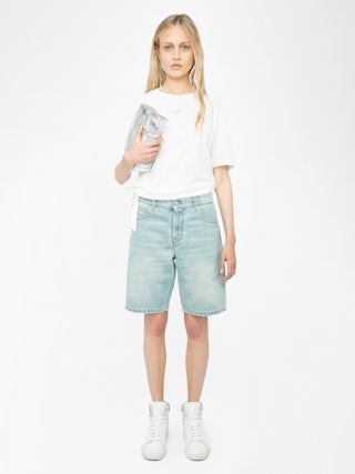 Camiseta Edda - Camiseta asimétrica de manga corta con pedrería en la parte delantera.