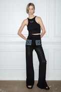 Pantaloni Flavy - Pantaloni ampi a crochet neri con tasche ricamate a contrasto - Donna