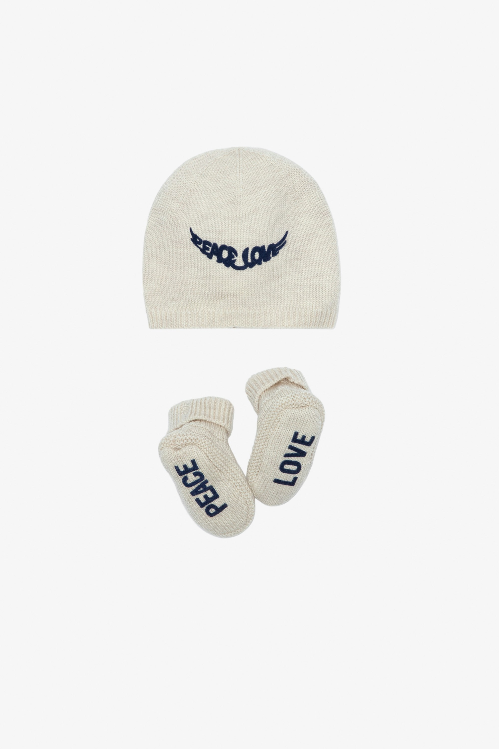 Completo Molly Neonato - Completo berretto e babbucce in maglia ecru con scritte "Peace" e "Love" da neonato.