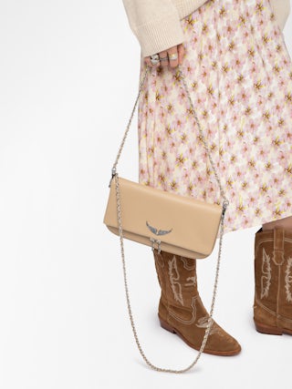 Rock Clutch - Grained leather clutch with double leather and metal chains and wings adorned with rhinestones.