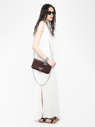 Rock Clutch - Grained leather clutch with double leather and metal chains and rhinestone-embellished wings.