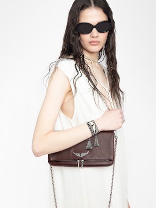 Rock Clutch - Grained leather clutch with double leather and metal chains and rhinestone-embellished wings.