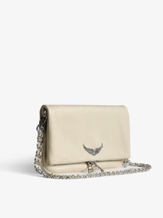 Rock Clutch - Clutch in grained leather with double leather and metal chains and wings adorned with rhinestones.