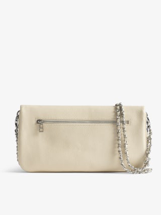 Rock Clutch - Clutch in grained leather with double leather and metal chains and wings adorned with rhinestones.