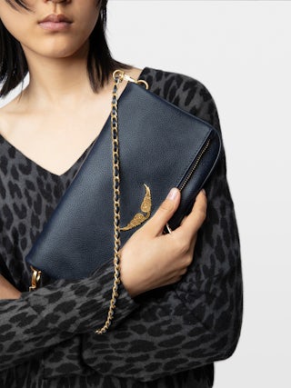 Rock Clutch - Grained leather clutch with double leather and metal chains and rhinestone-adorned wings.