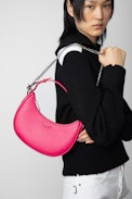 Moonrock Bag - Women’s half-moon bag in pink grained leather with a short handle, shoulder strap, chain and signature wings.