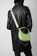 Moonrock Bag - Women’s half-moon bag in green grained leather with a short handle, shoulder strap, chain and signature wings.