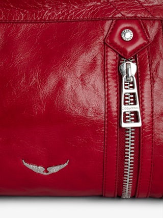 Sunny Moody Vintage Patent Bag - Vintage patent leather bag with adjustable shoulder strap and wing signature.