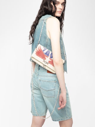 Rock Clutch - Grained leather pochette with double leather and metal chain and rhinestone-embellished wings.