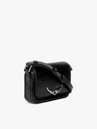 Le Zazi Vintage Patent Bag - Small vintage-inspired patent leather bag with adjustable shoulder strap and signature wings.